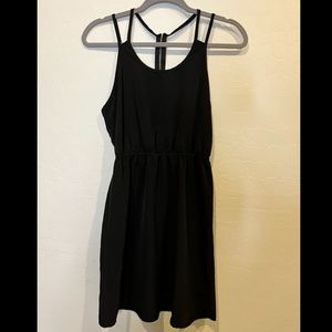 Black dress with spaghetti straps.